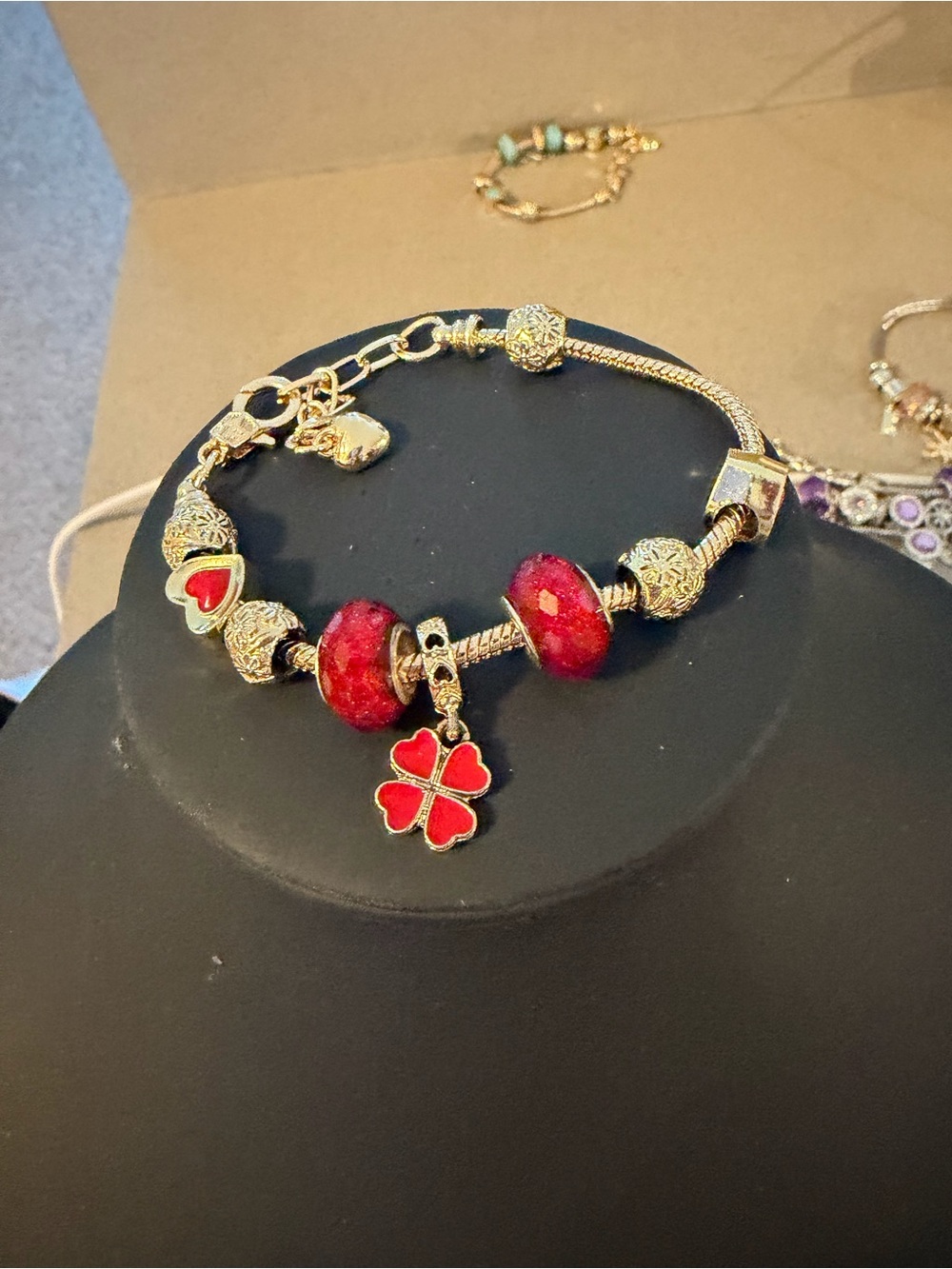 Gold-Tone Bracelet with Red Enamel Beads and Clover Charm